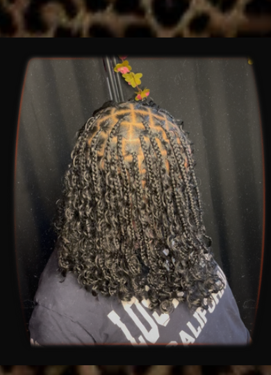 Knotless braids with boho curl finish